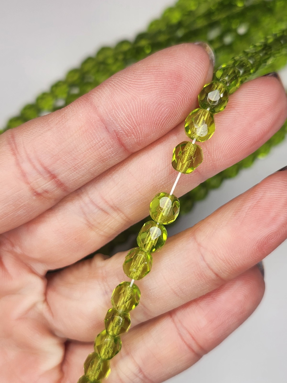 25 PC 6mm Czech Fire Polished Round Faceted Beads in Light Olivine Green strand