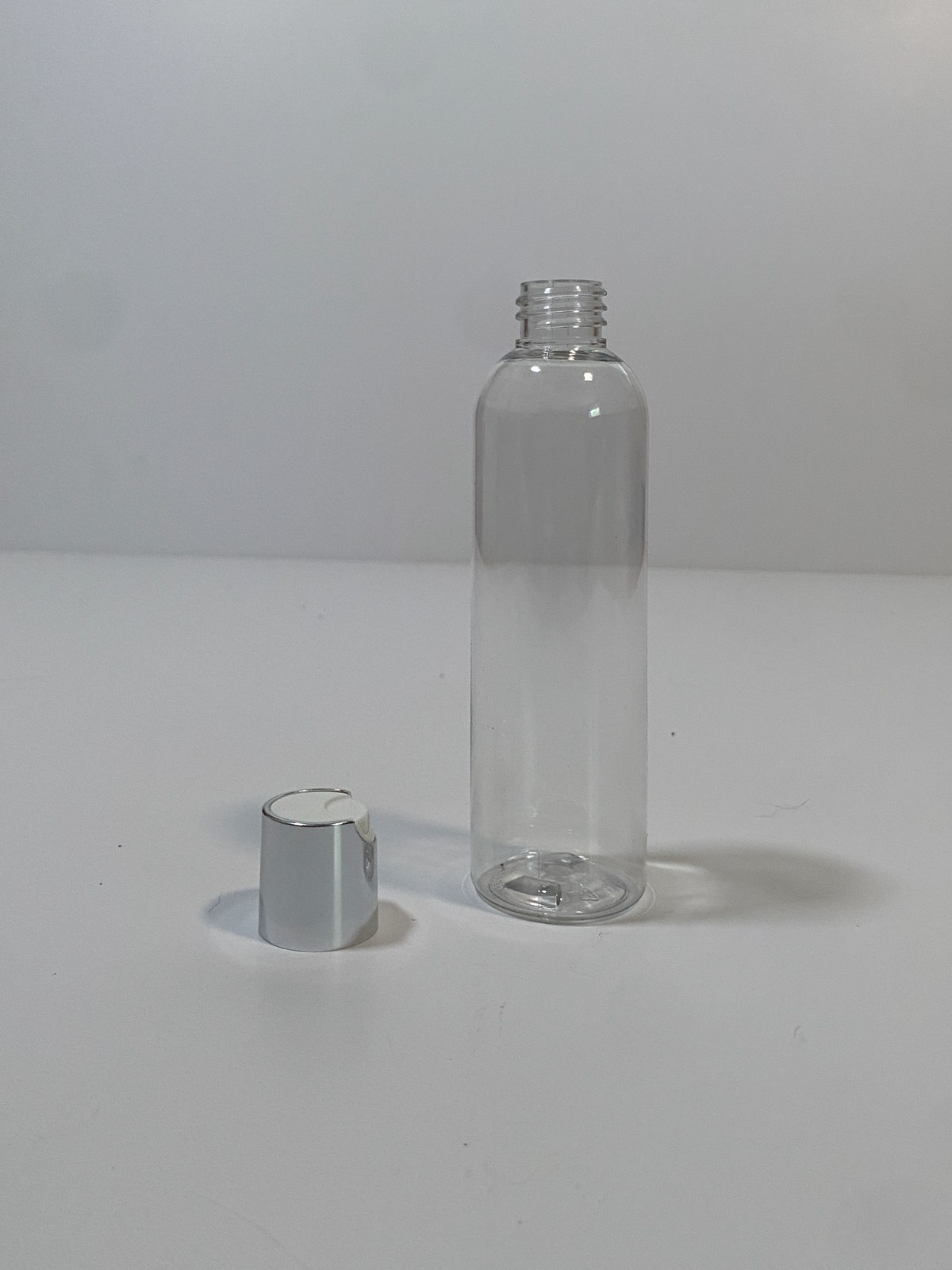 12 clear plastic bottles with silver and white cap 2oz free labels