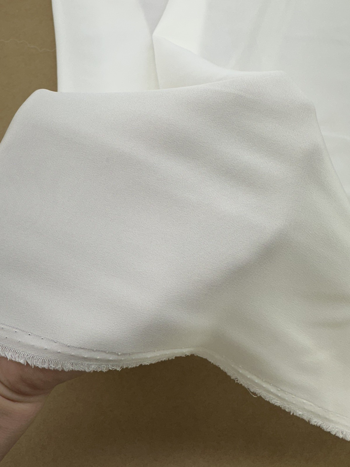 100% Silk heavy crepe , light Ivory color, 55”W, sold by yard