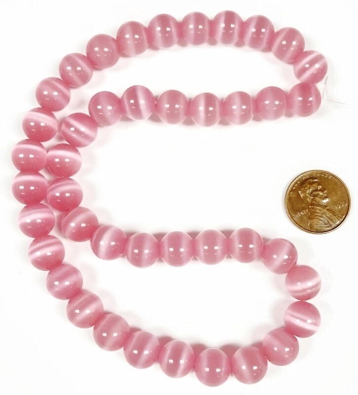 38 Cat’s Eye Fiber Optic Glass Muted Pink 10mm. Smooth Round Beads 2604