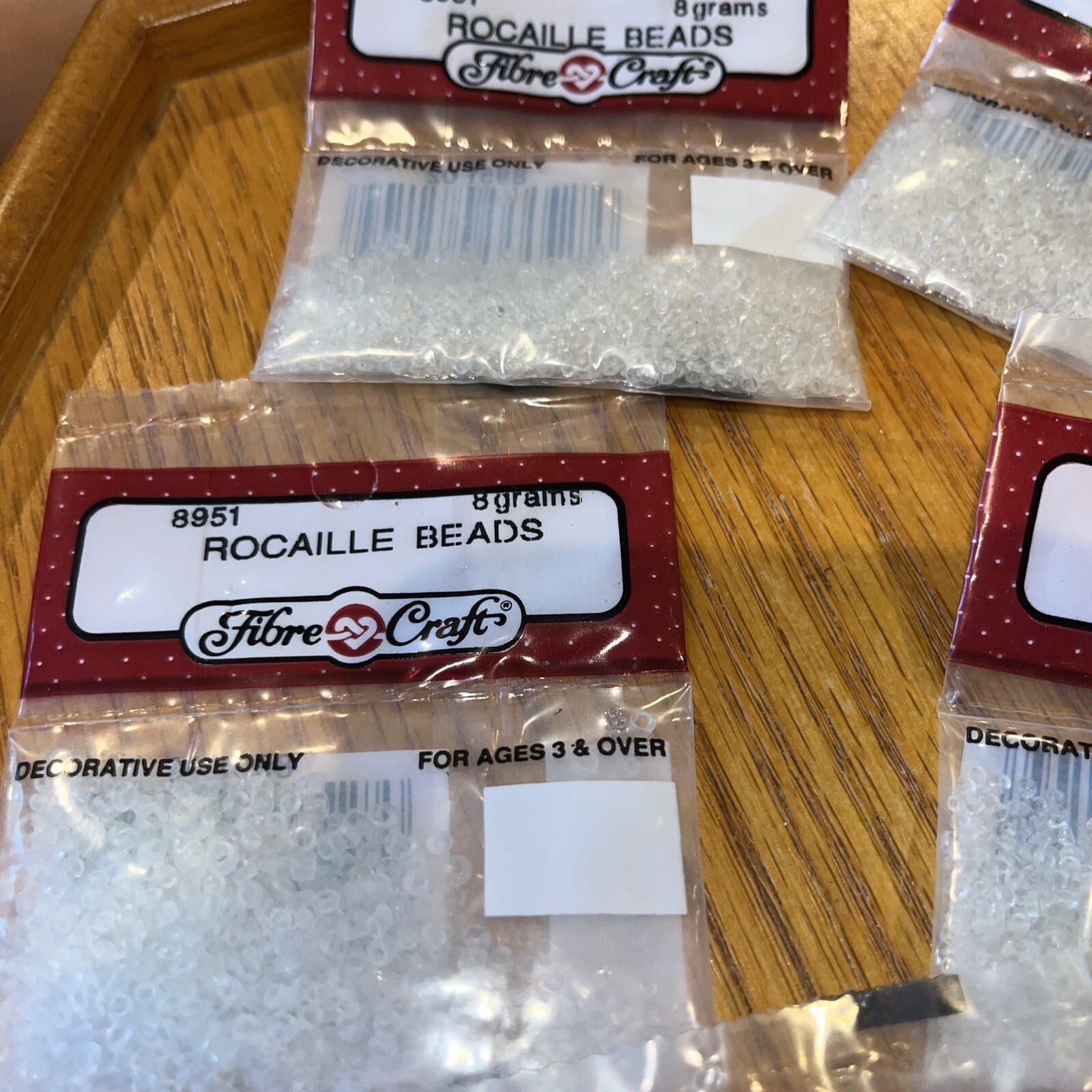 fibre craft Rocaille Beads # 8951 clear -7 bags each bag 8 grams