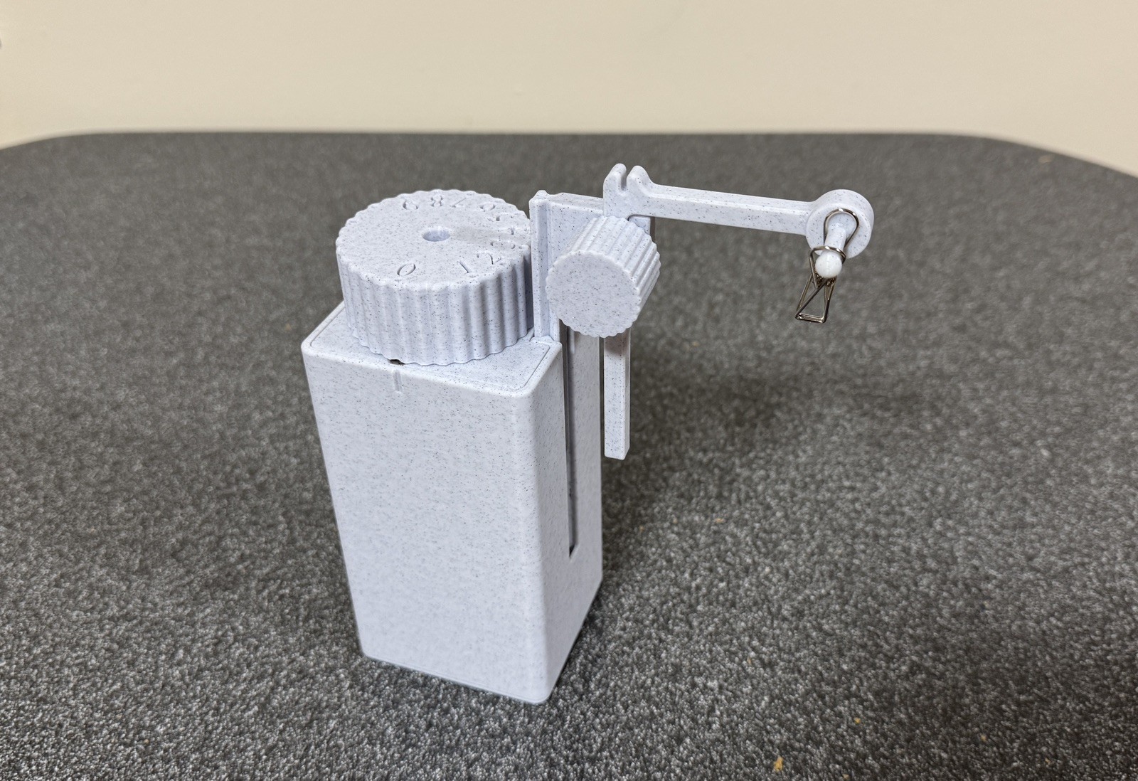 Tea timer with tea bag lifter. Patent pending, made in USA.