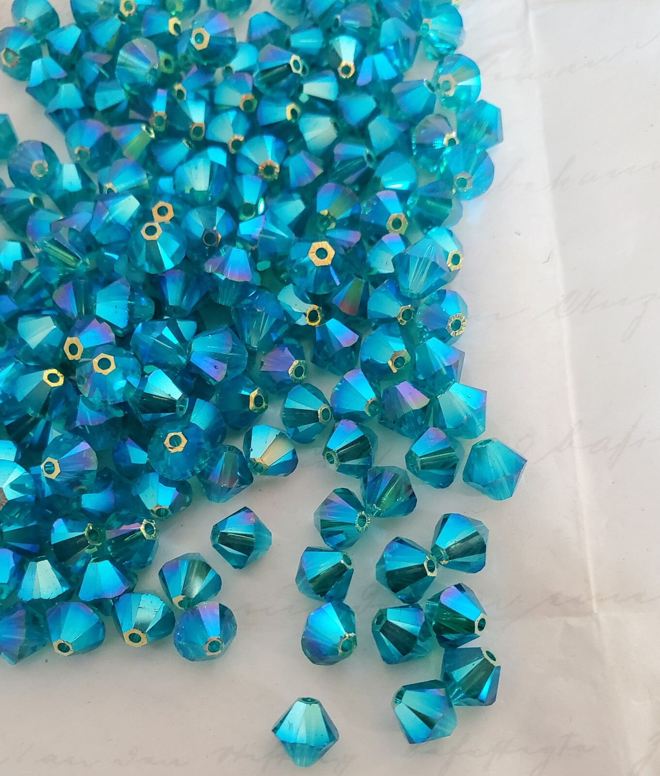 Swarovski 5301 6mm bicone beads, Blue Zircon AB2X (12pcs)