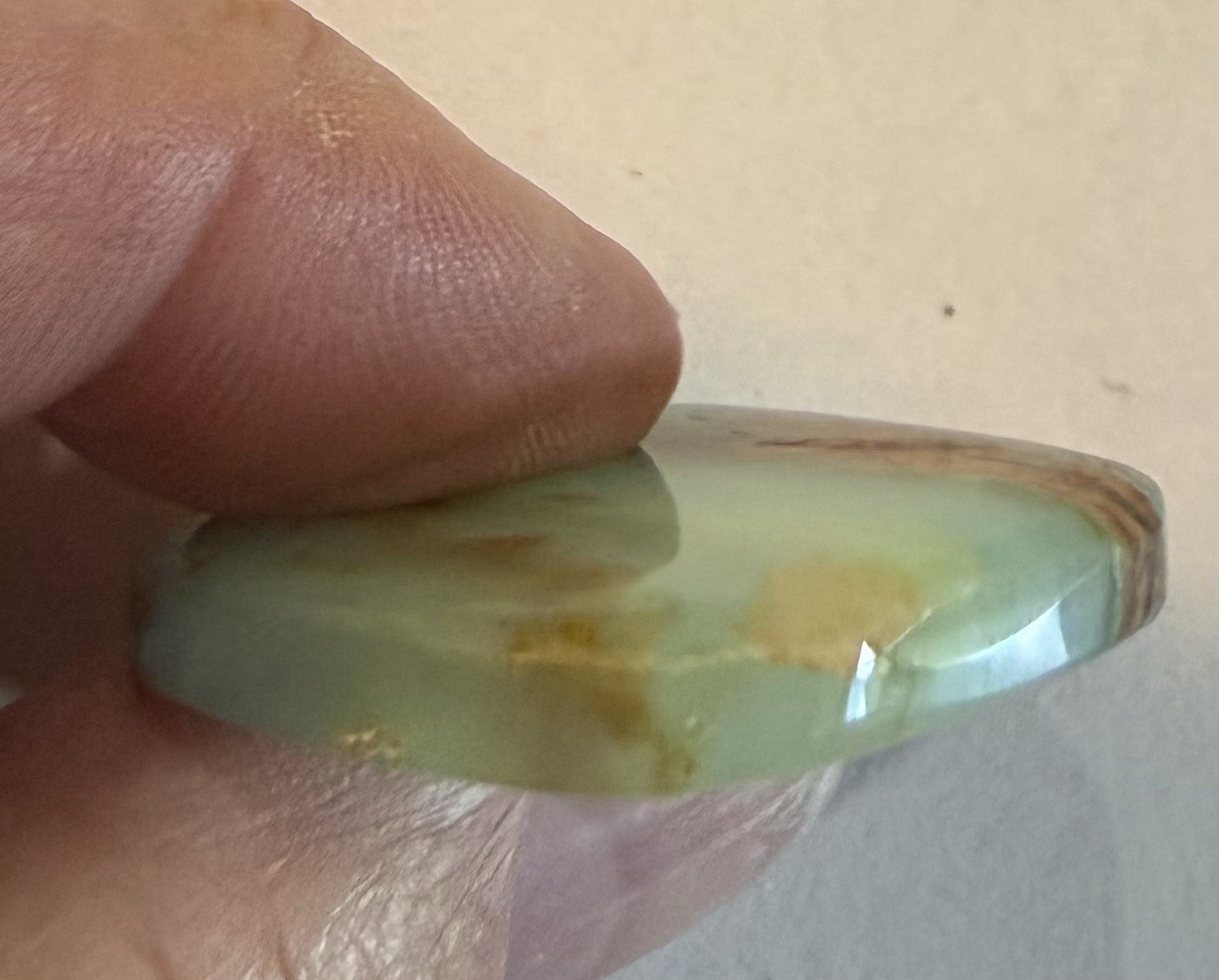 Peruvian Opal Cabochon. 1 1/4” x 1 3/16” x 1/4”, 0.3 oz. Polished all sides.