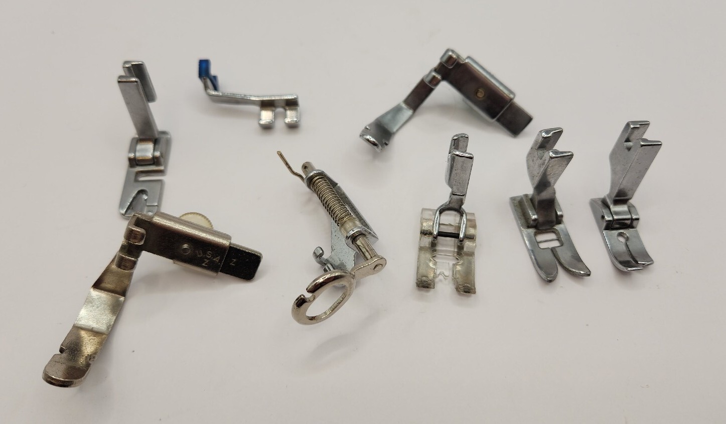 Bundle of 8 Sewing Machine Foot Parts–None Marked
