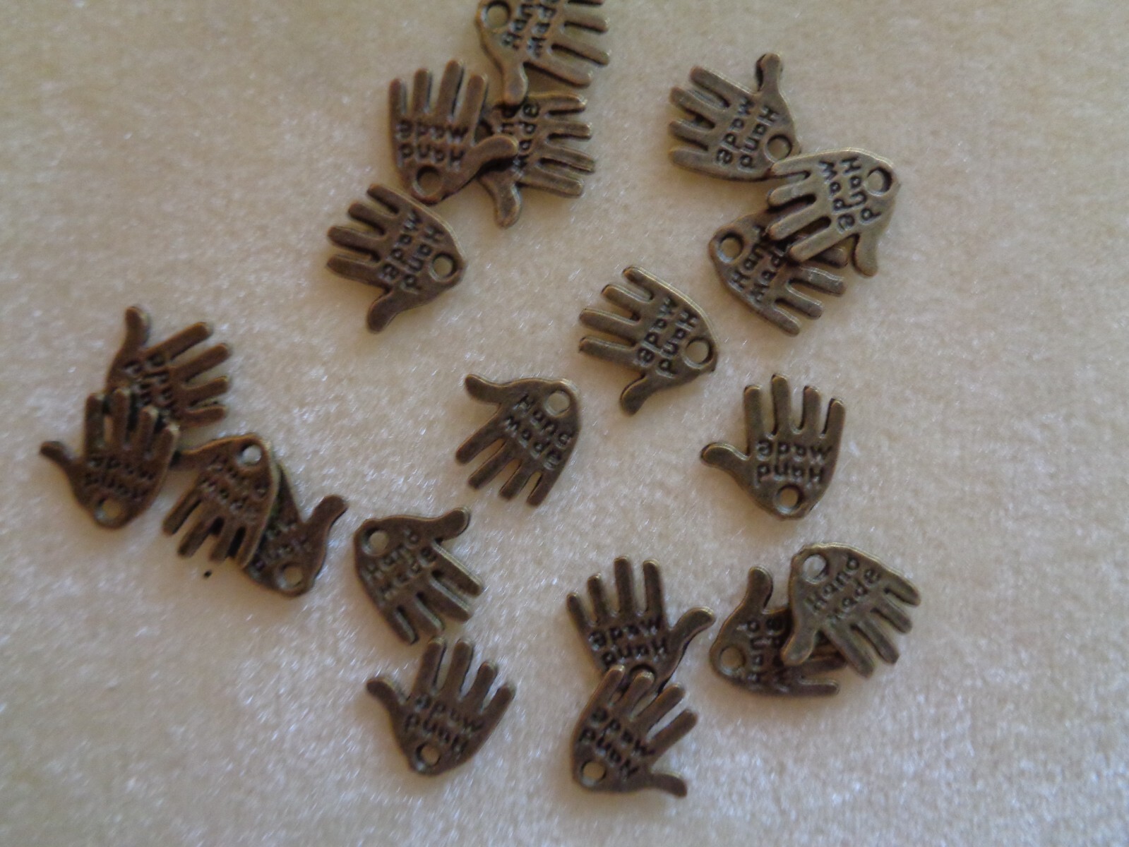 Charm, antique brass, 10x 10mm double-sided “hand-made”