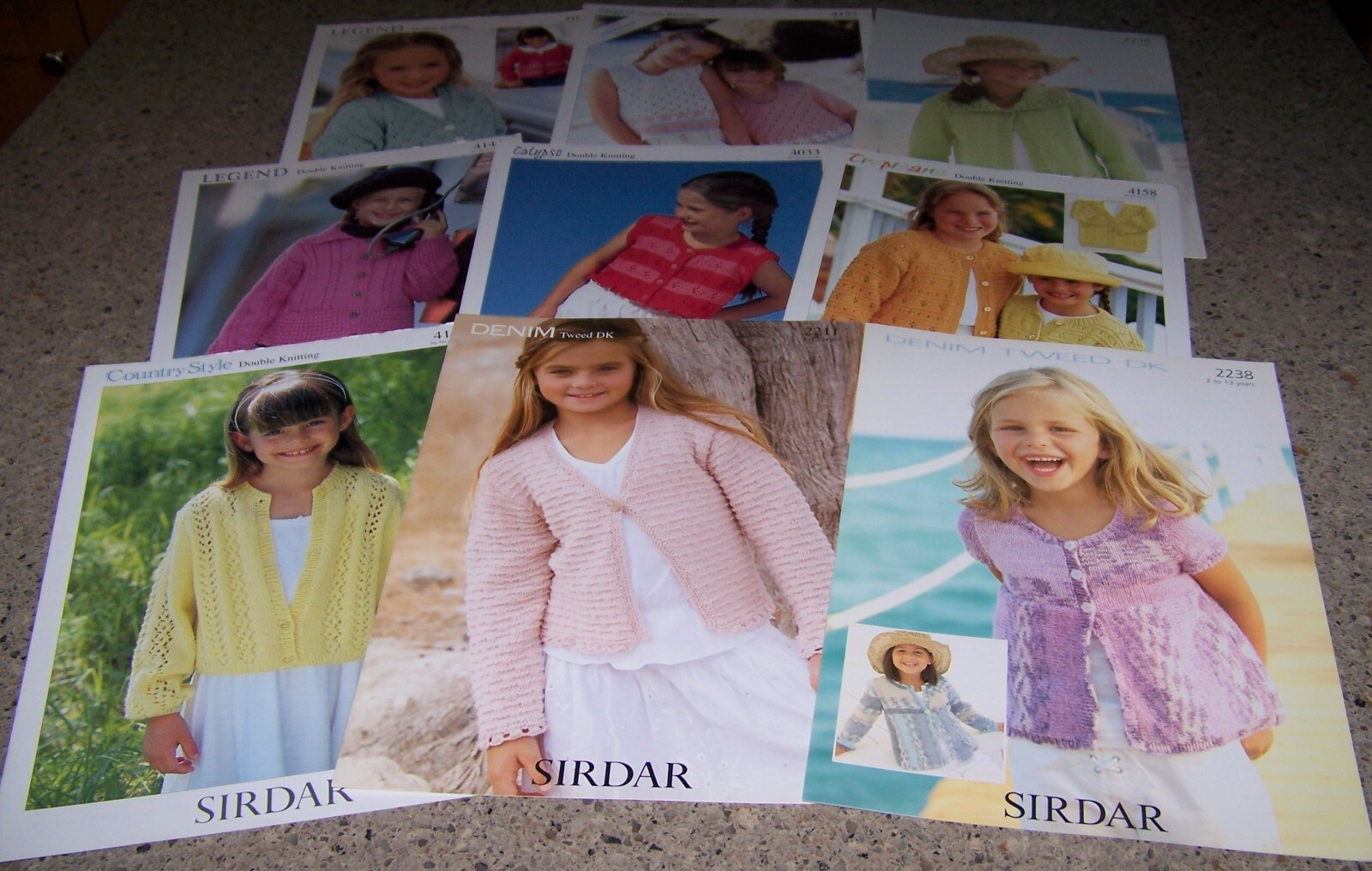 Lot of 9 SIRDAR dk Knitting Yarn Patterns for GIRLS Ages 1 thru 13 years