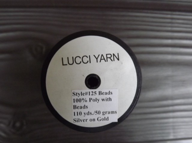 Lucci Yarn Style #125 beads, poly chain with glass beads, 110 yards/50 gr. spool