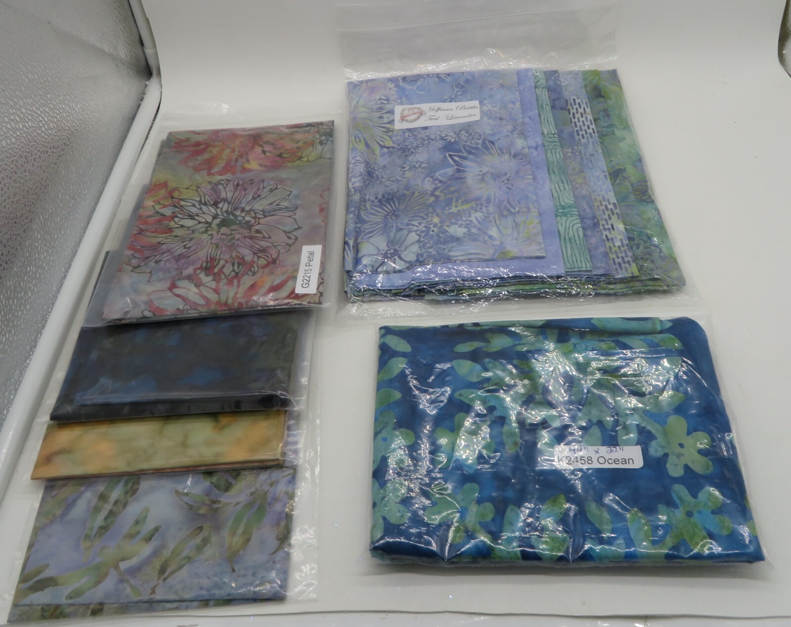 Large Lot of 11 Batik Fat Quarters & One 44″ x 22″ batik fabric piece