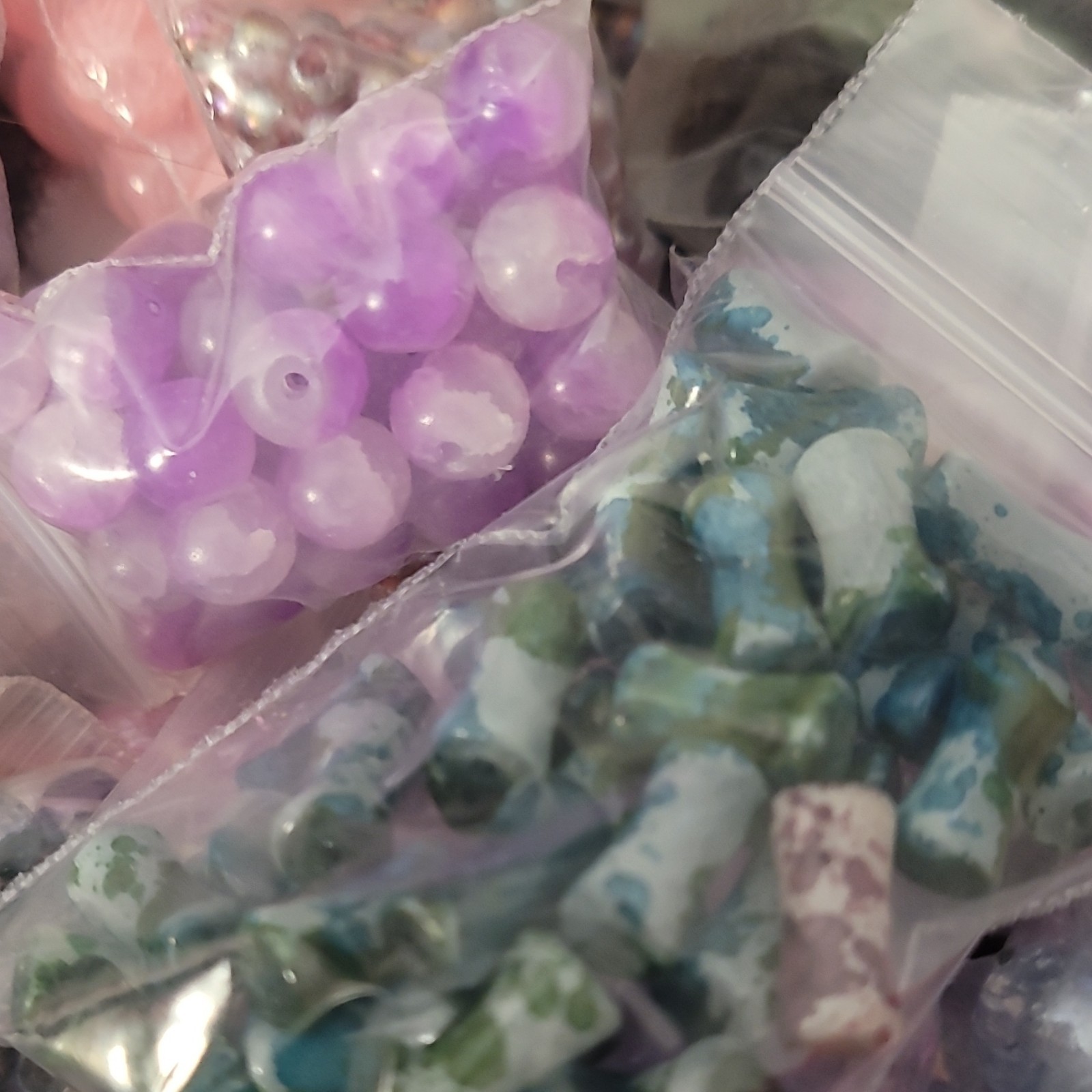 100 bags of Loose Glass Beads of all shapes sizes and colors
