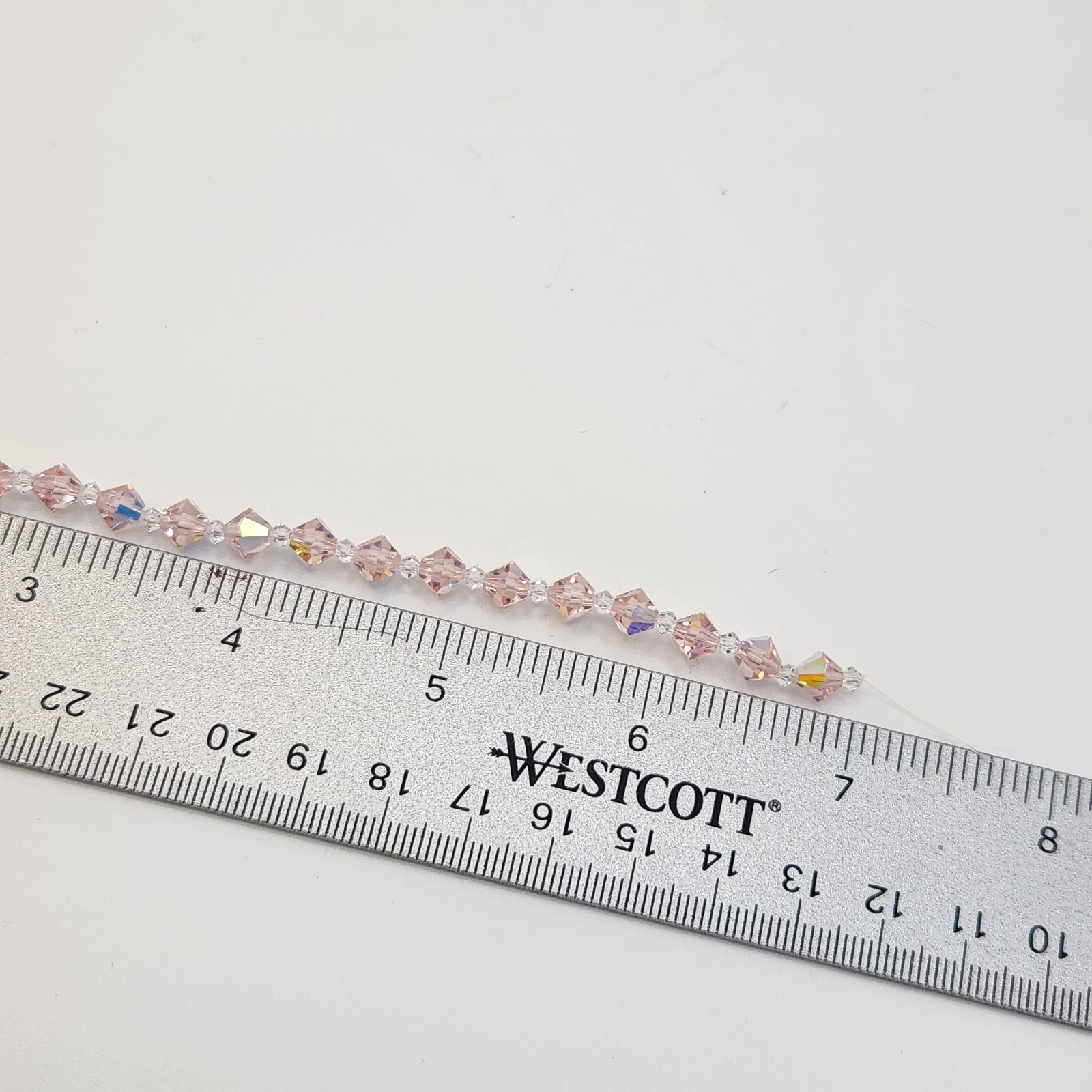 Preciosa Crystal Bead Strand by Darice Rose Pink Iridescent Round Faceted