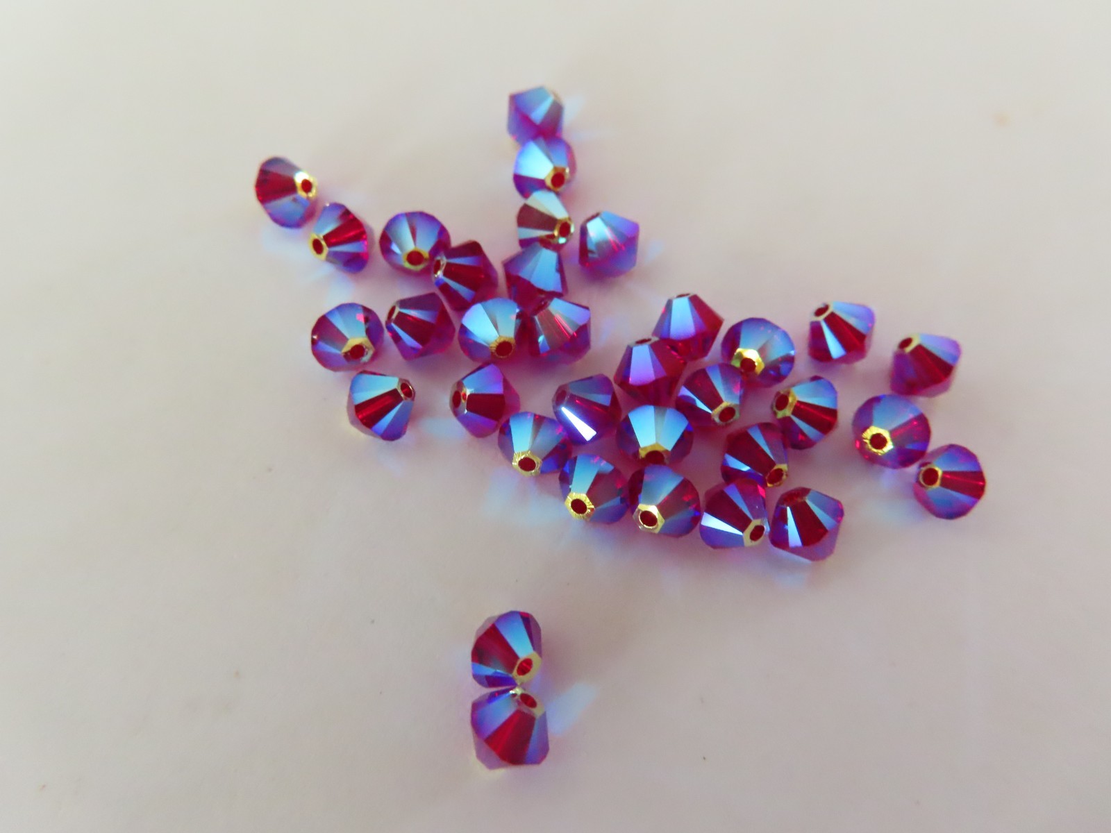 36 Swarovski Bicone Beads 4mm Siam AB 2x. #5328