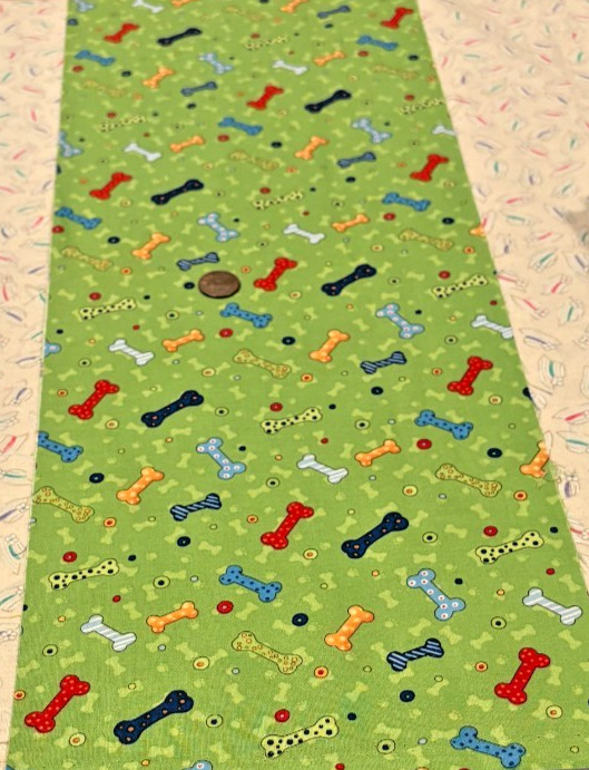 Colorful Dog Bones * on Green * SSI * 100% Cotton Remnant * 8″ x 22″