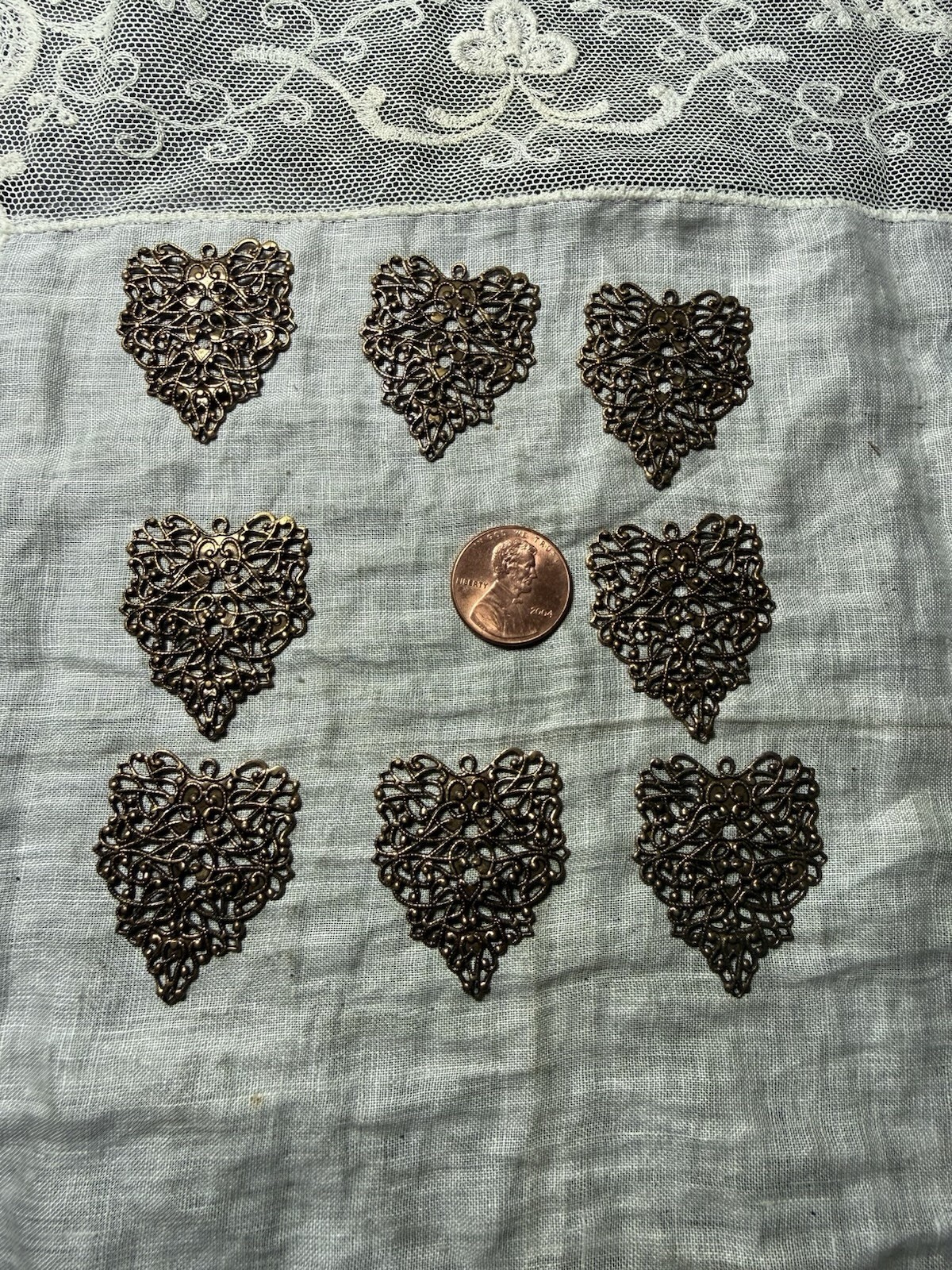 8 Antique Gold Colored Filigree Heart Shaped Dangles