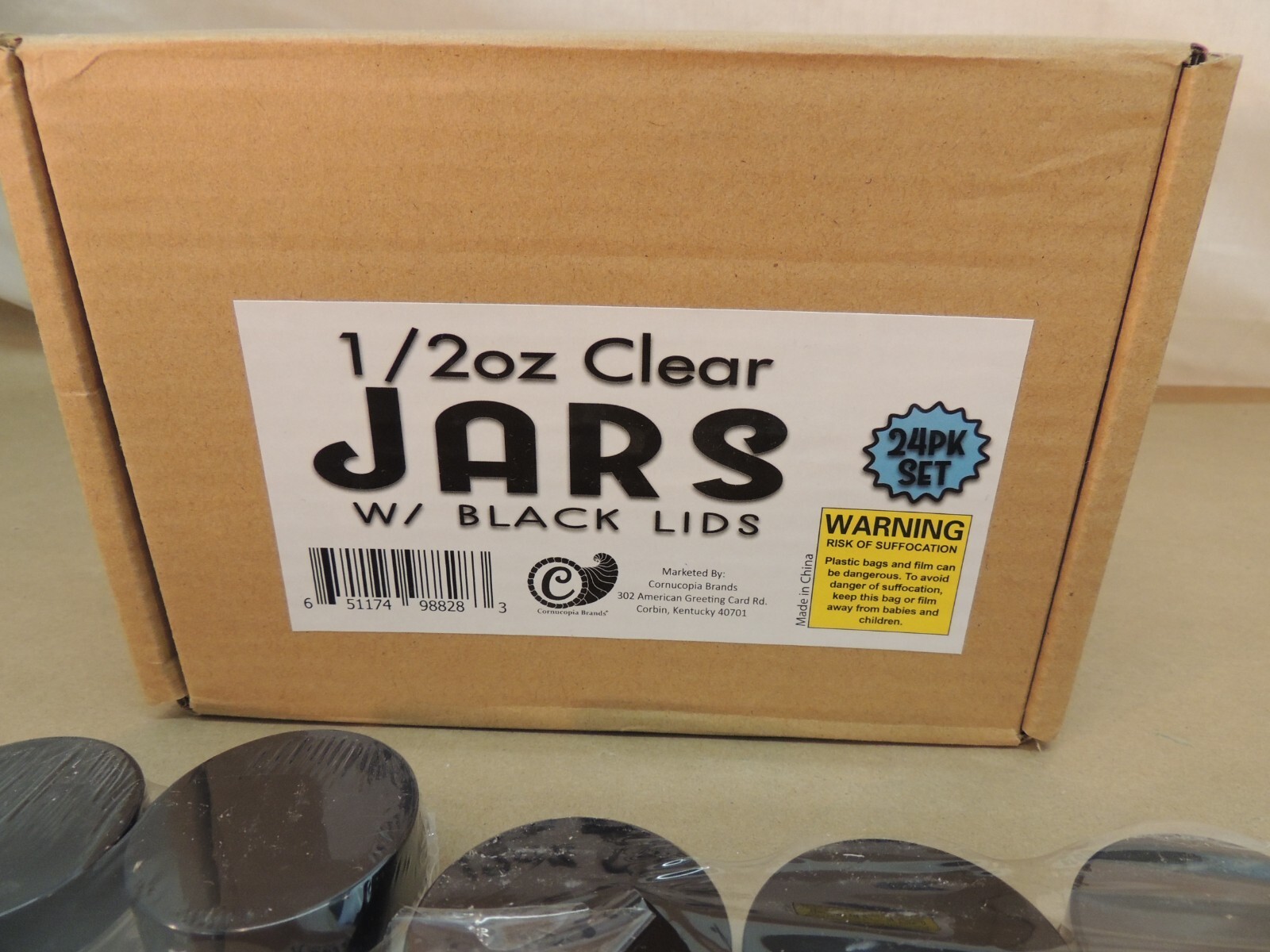 1/2 OZ, HALF OUNCE, CLEAR JARS WITH BLACK LIDS, OPENED BOX, 23 JARS REMAINING