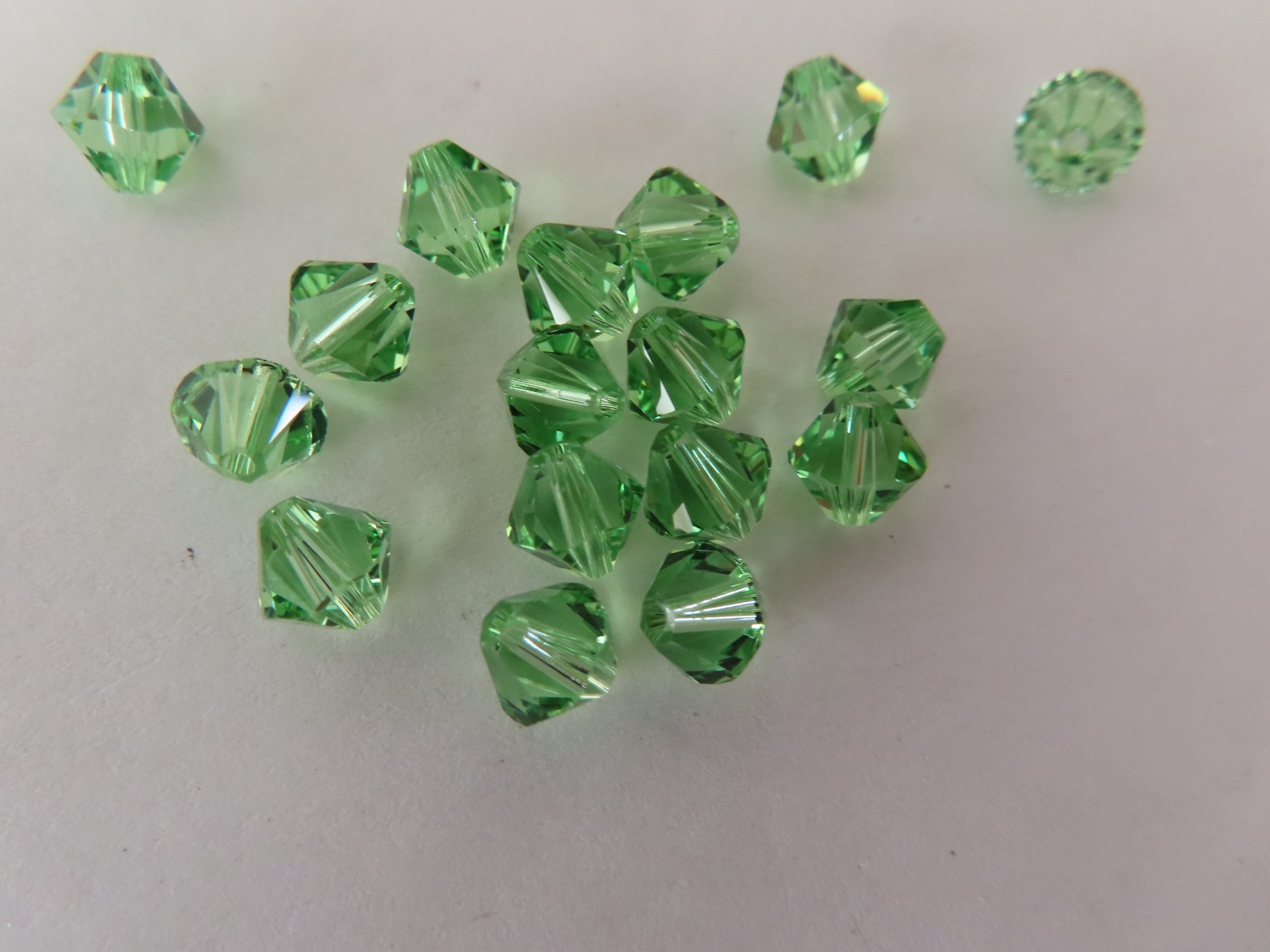 18 Swarovski Bicone Beads 6mm Peridot. #5328