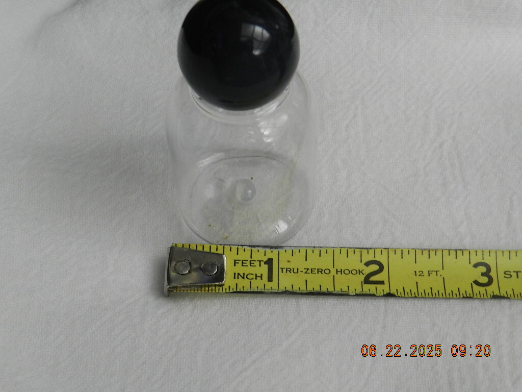 Lot 46 Clear plastic 1oz bell shaped bottle with round black ball top