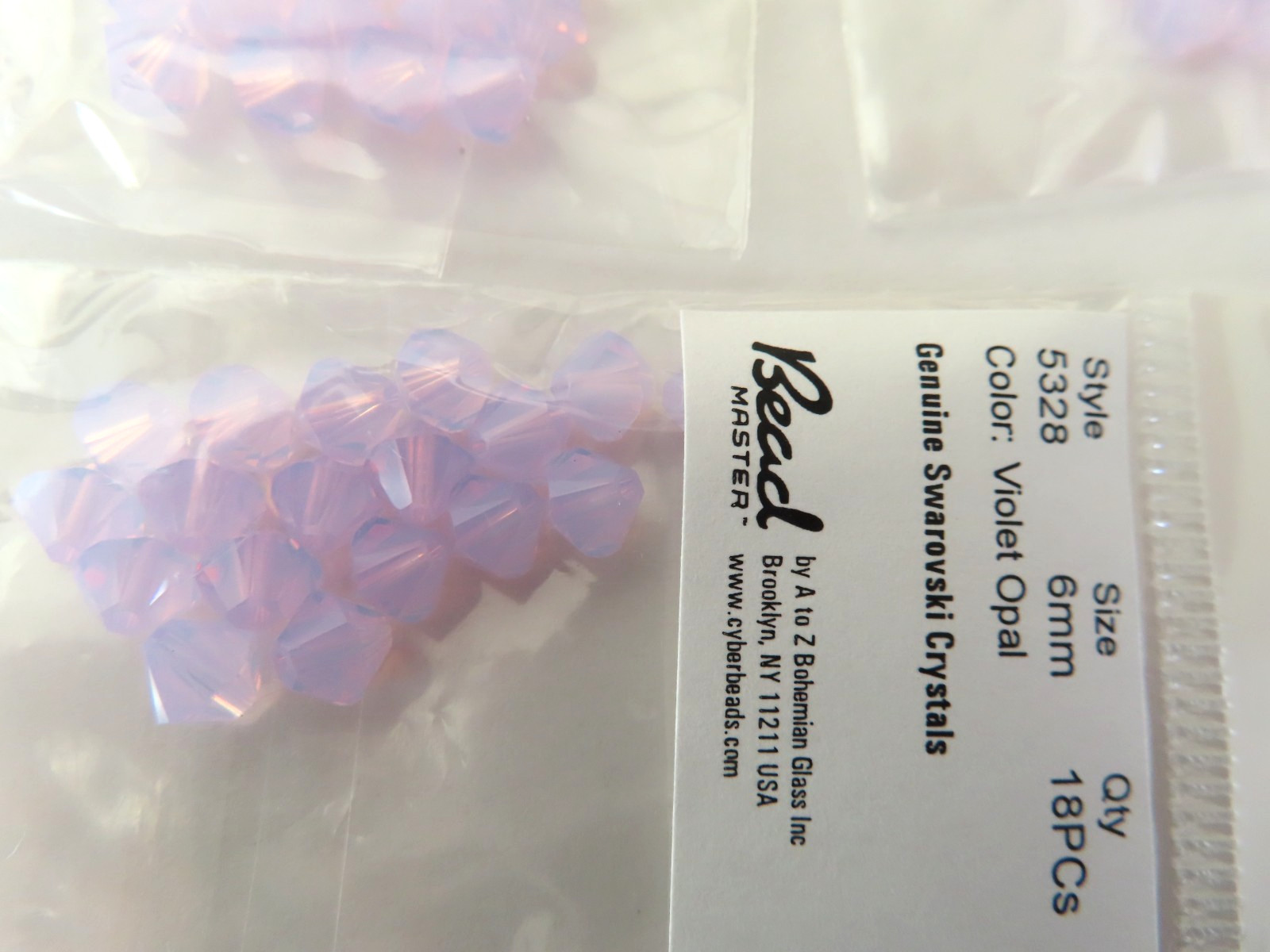 18 Swarovski Bicone Beads 6mm Violet Opal. #5328
