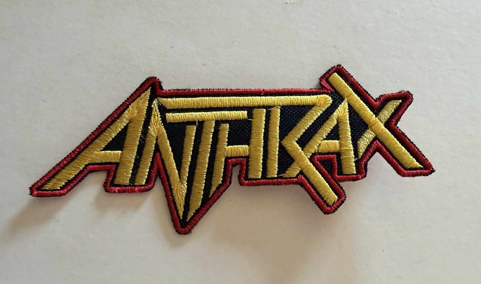 ANTHRAX, RED AND YELLOW BAND LOGO, 4.25X2.0 INCHES, EMBROIDERED PATCH