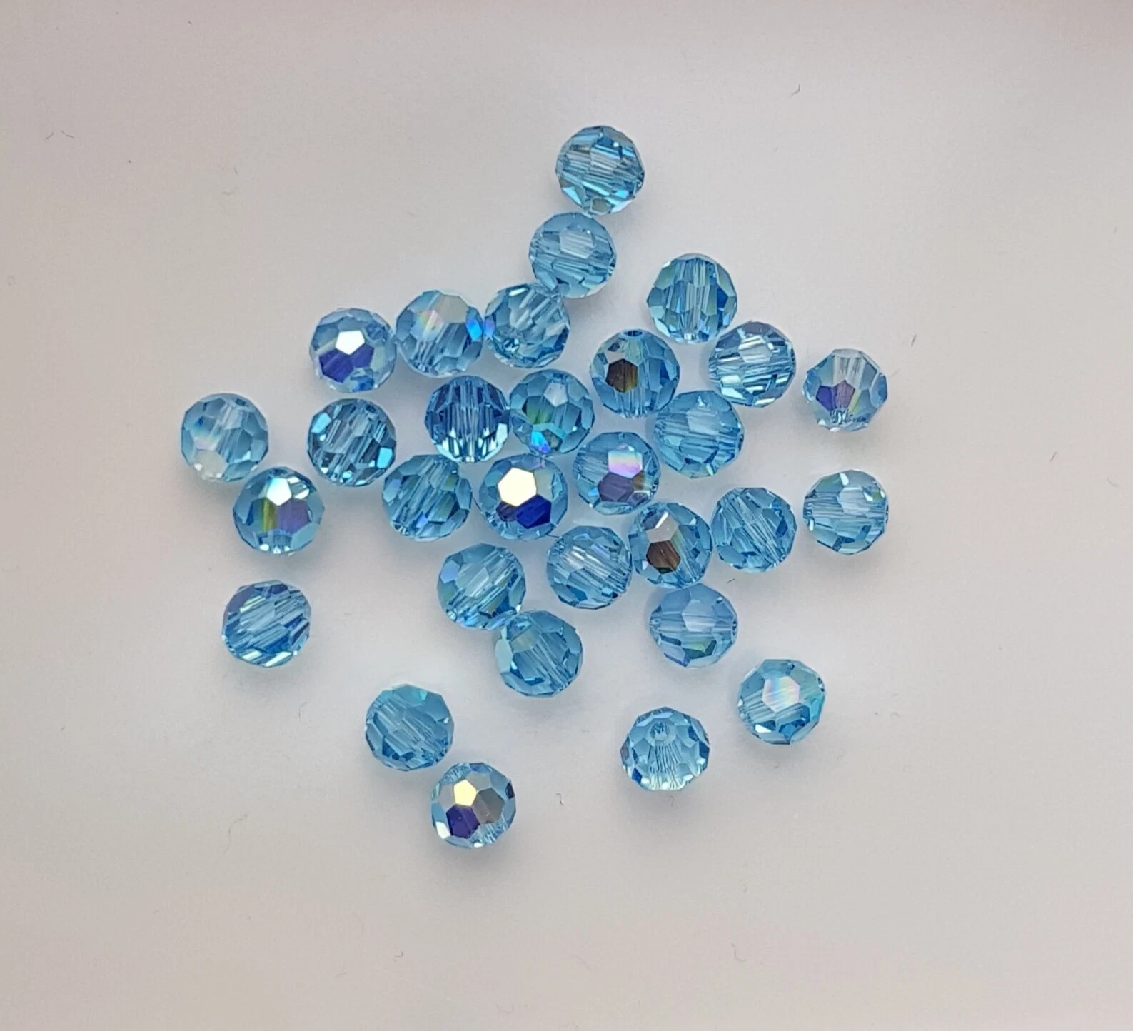 144x Swarovski 5000 Crystal AB 6mm Bicone Beads – Genuine Xilion Cut Bulk Pack