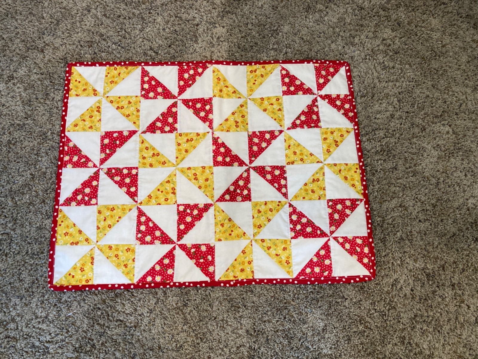 Handmade table topper – red and yellow pinwheels – 18” x 24”