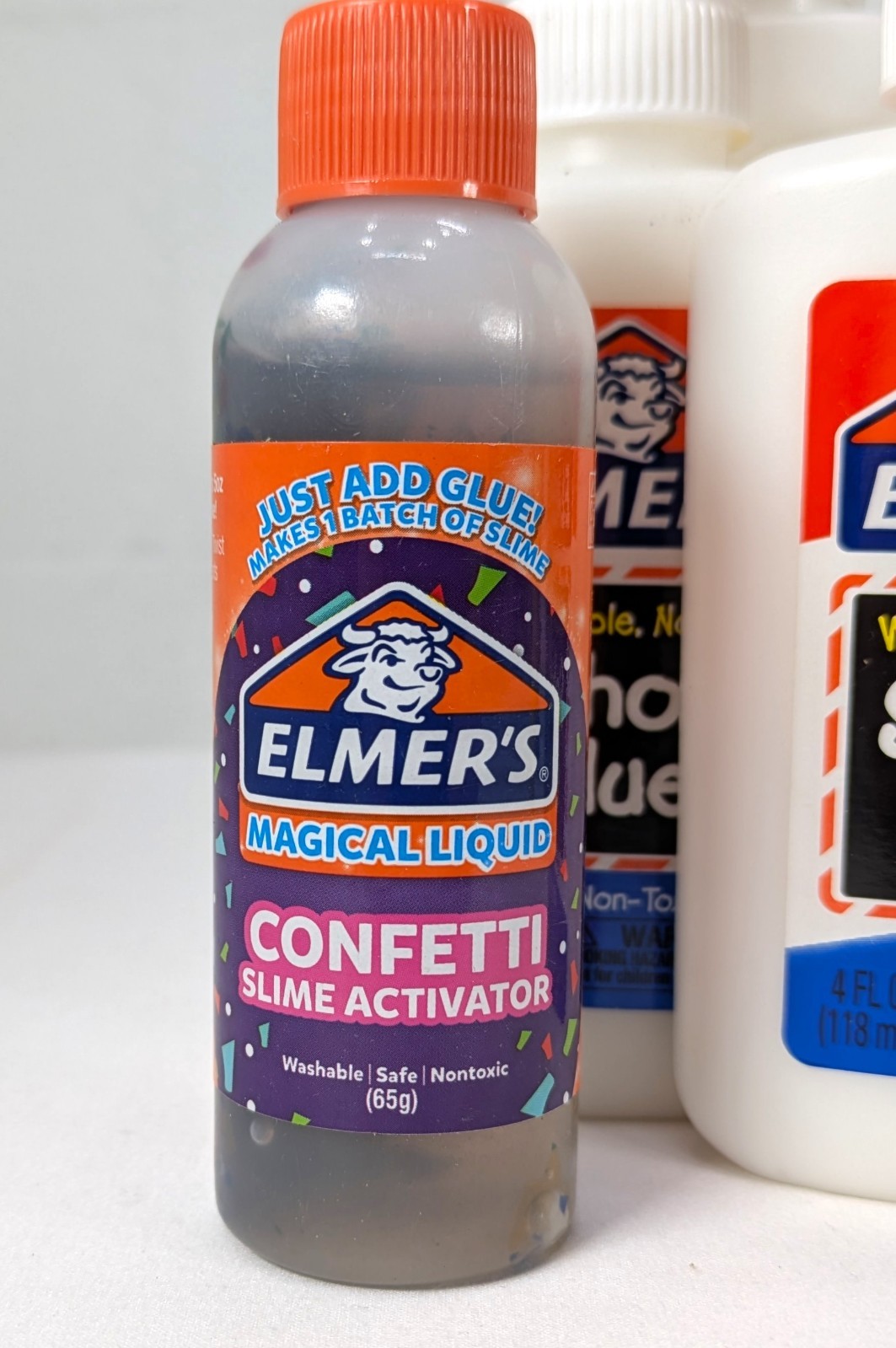 set of school glue and Elmer’s Magical Liquid confetti slime activator Crayola