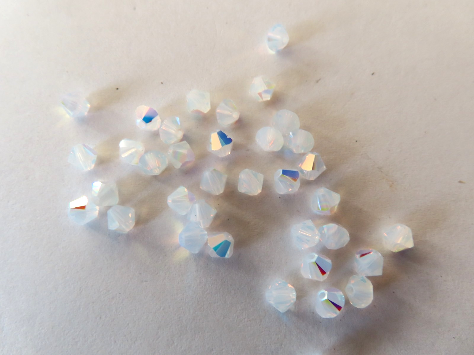 36 Swarovski Bicone Beads 4mm White Opal AB. #5328