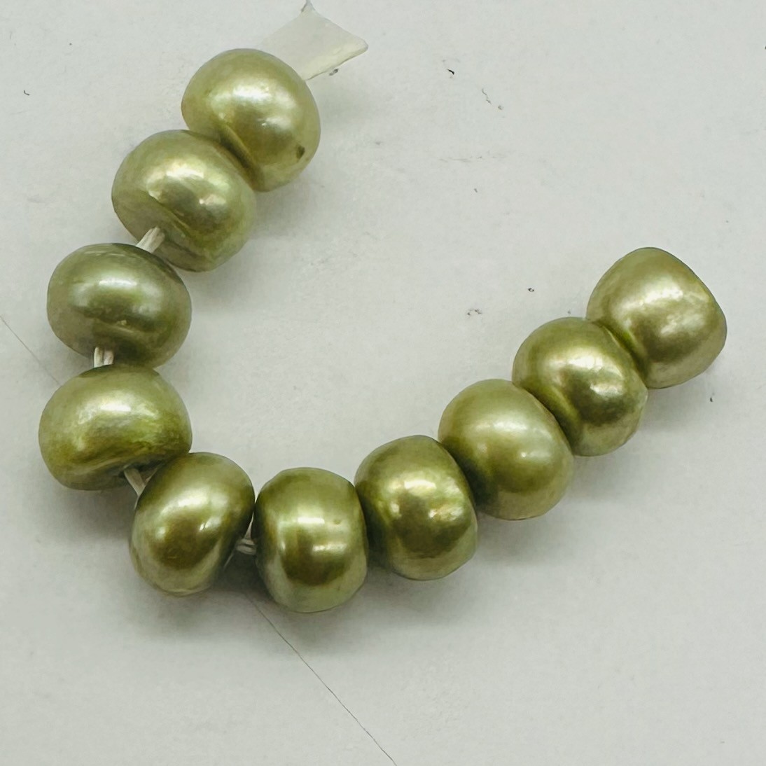 Dubai Pistachio Fresh Water Pearl Parcel | 7x5mm | Green } 10 Pearls |