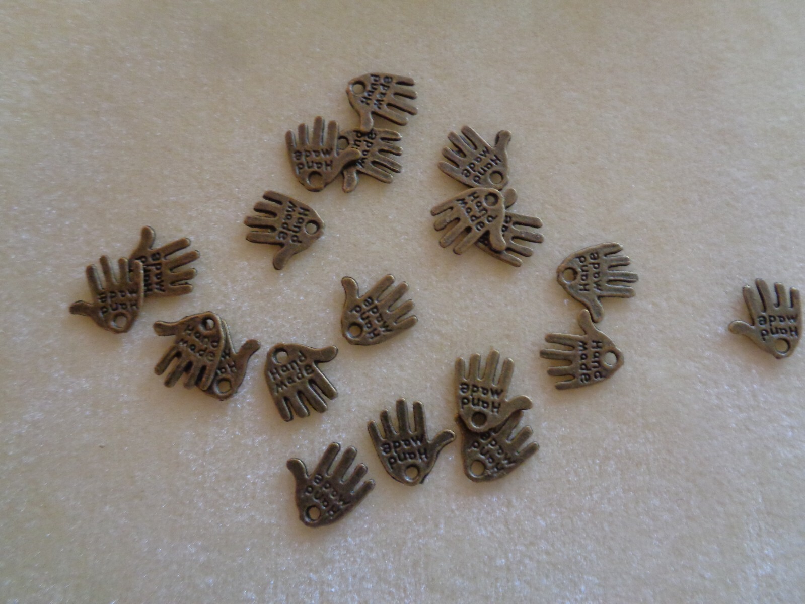 Charm, antique brass, 10x 10mm double-sided “hand-made”
