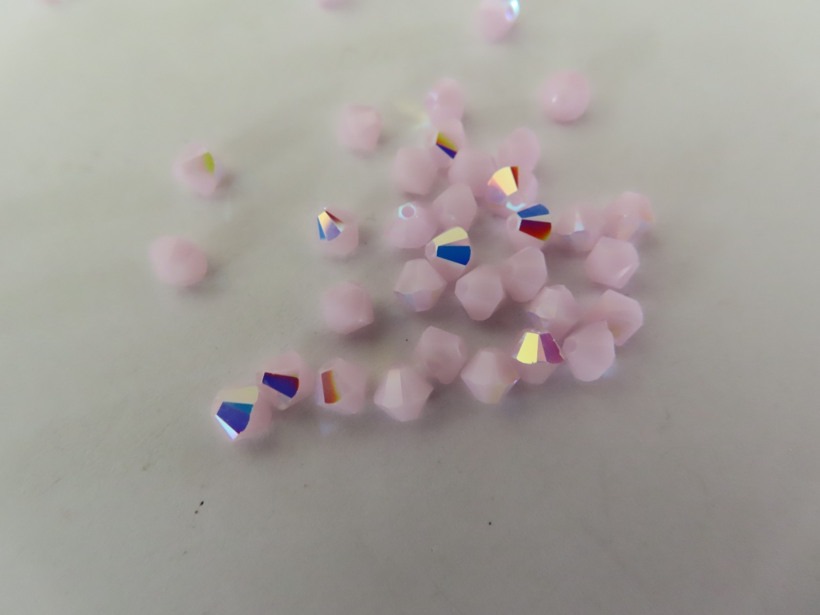 36 Swarovski Bicone Beads 4mm Rose Alabaster AB. #5328