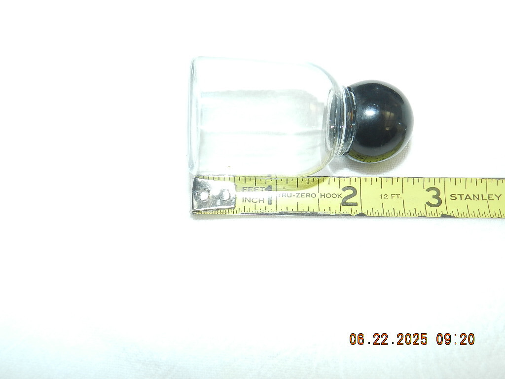 Lot 46 Clear plastic 1oz bell shaped bottle with round black ball top
