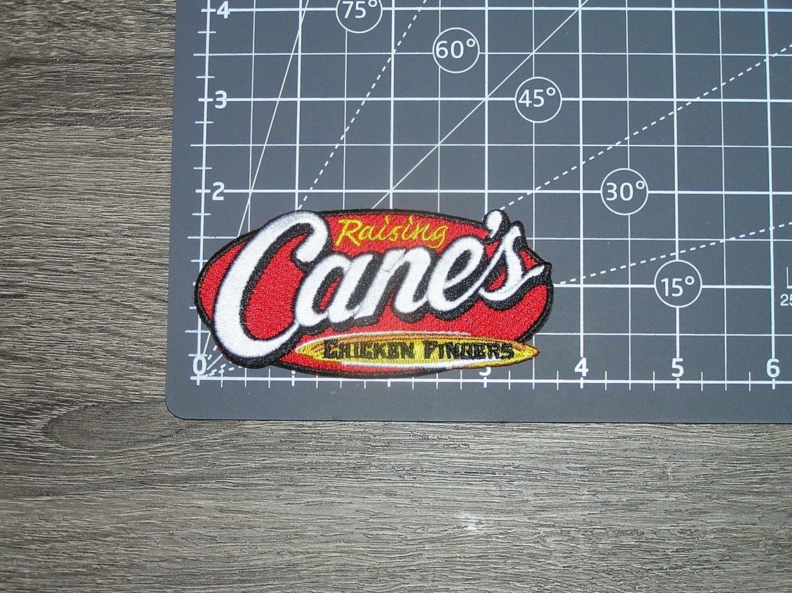 Raising Cane’s Chicken Fingers Restaurant Embroidered Iron On Patch 3.75″ x 1.75
