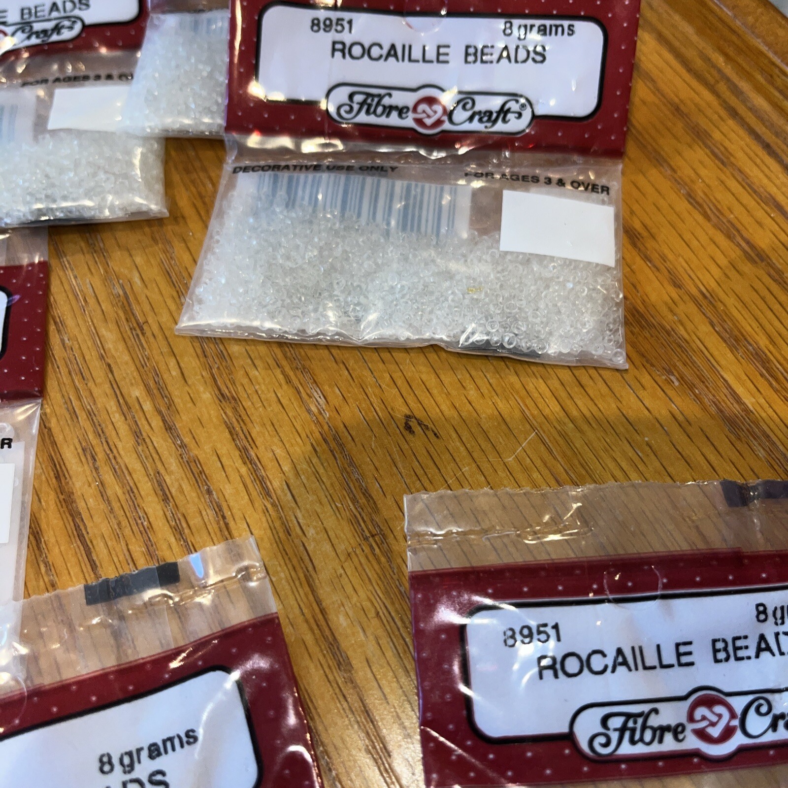 fibre craft Rocaille Beads # 8951 clear -7 bags each bag 8 grams