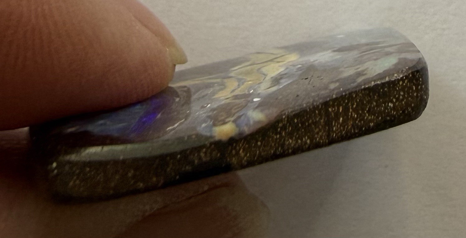 Australian Boulder Opal Cabochon. 1 3/8”x 1 5/16”x 1/8”, 0.3 oz. Polished front