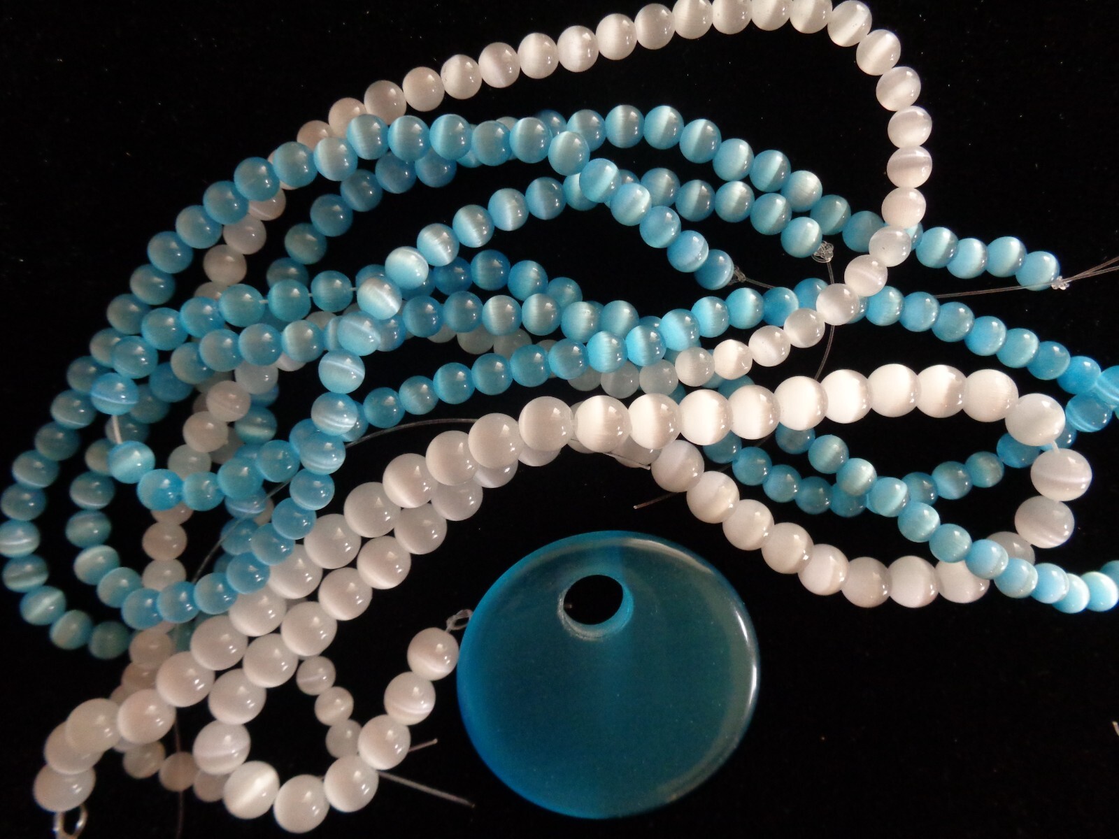 Bead, cat’s eye glass (fiber optic glass), white, 6 &8 mm round, quality grade.