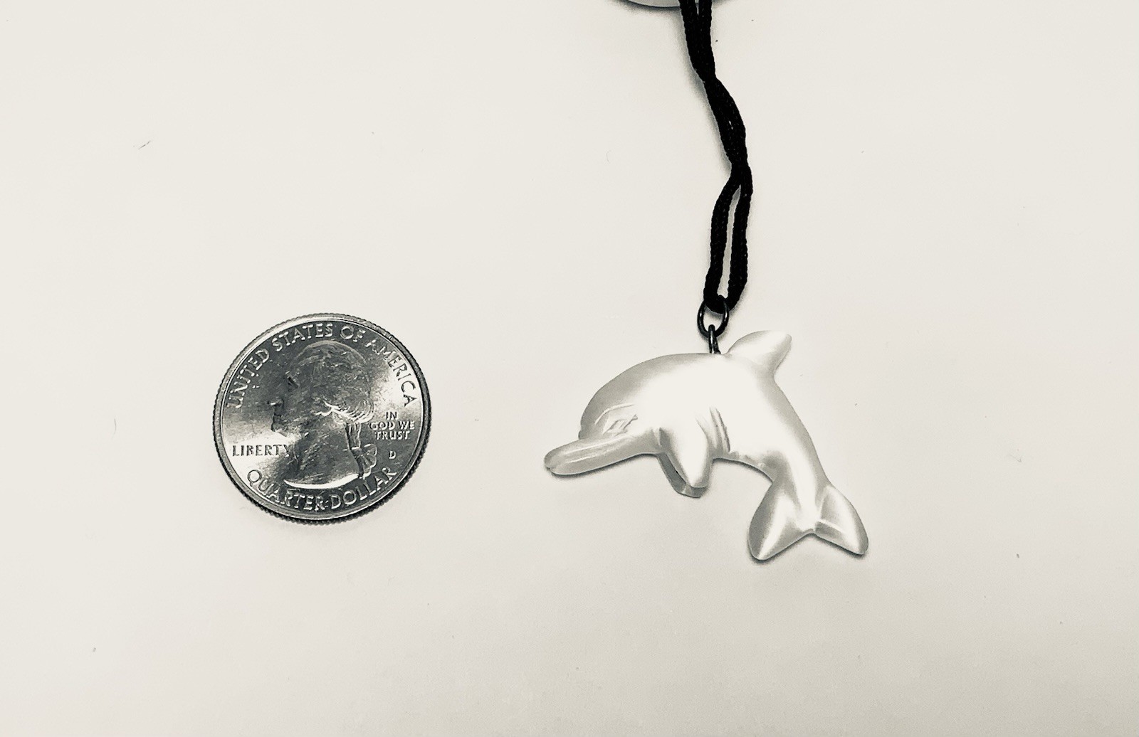 Beautiful White Fiberoptic Cat’s eye Glass dolphin pendant