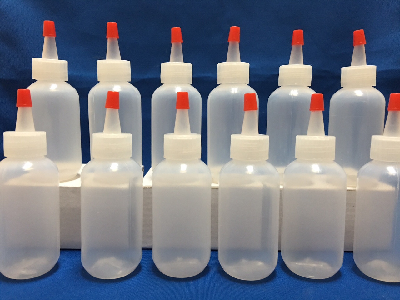 12 pack of 2oz (60mL) Plastic Boston Round Squeeze Bottles with Yorker Caps LDPE