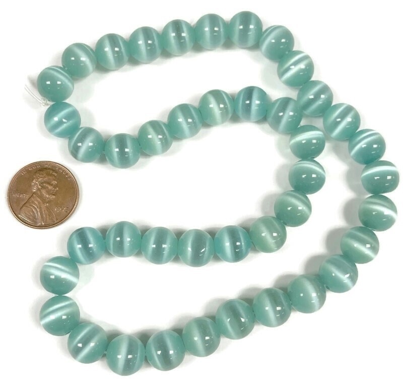 38 Cat’s Eye Fiber Optic Glass Green Turquoise 10mm. Smooth Round Beads 2590