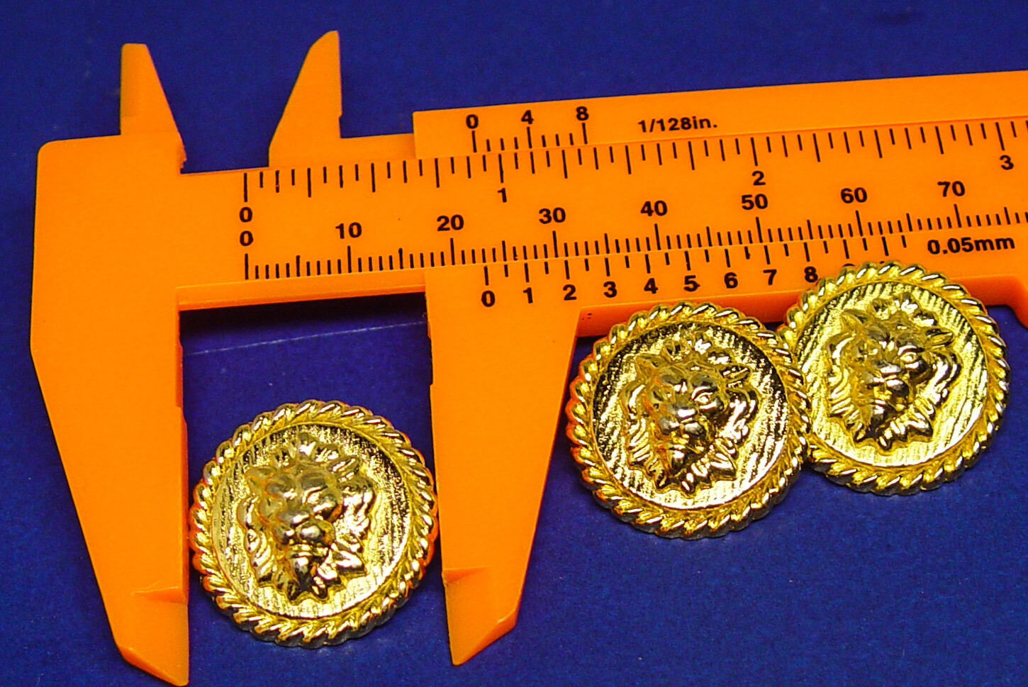 3 Unknown brand gold tone Lion-head solid metal buttons, good used condition