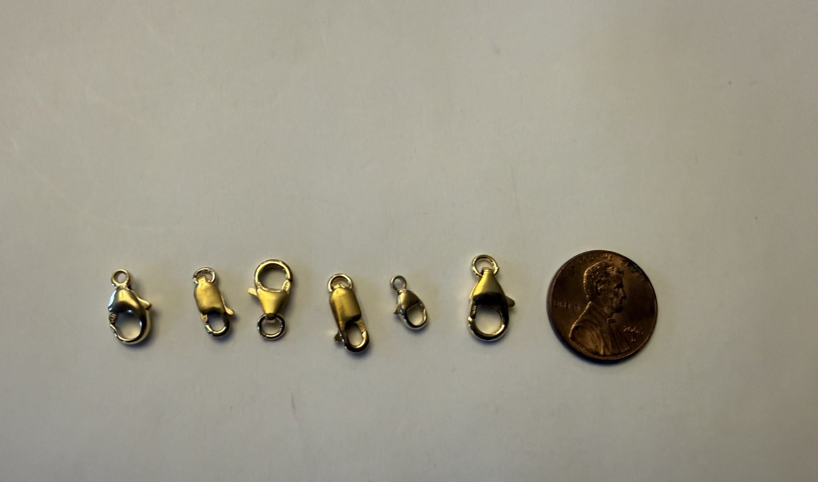 14kt Gold filled Assorted sizes lobster clasps. 16 pcs total.