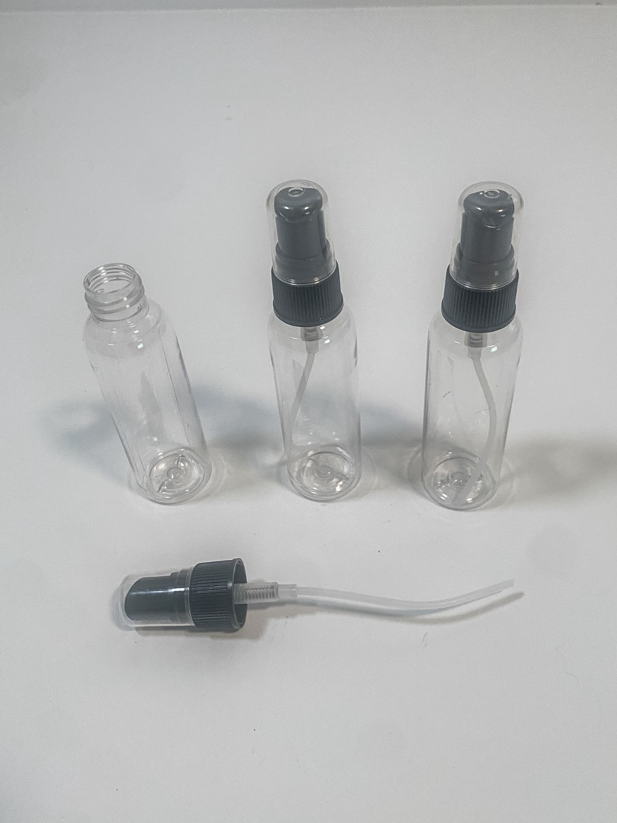 20 clear plastic spray bottles with black spray caps and tubes