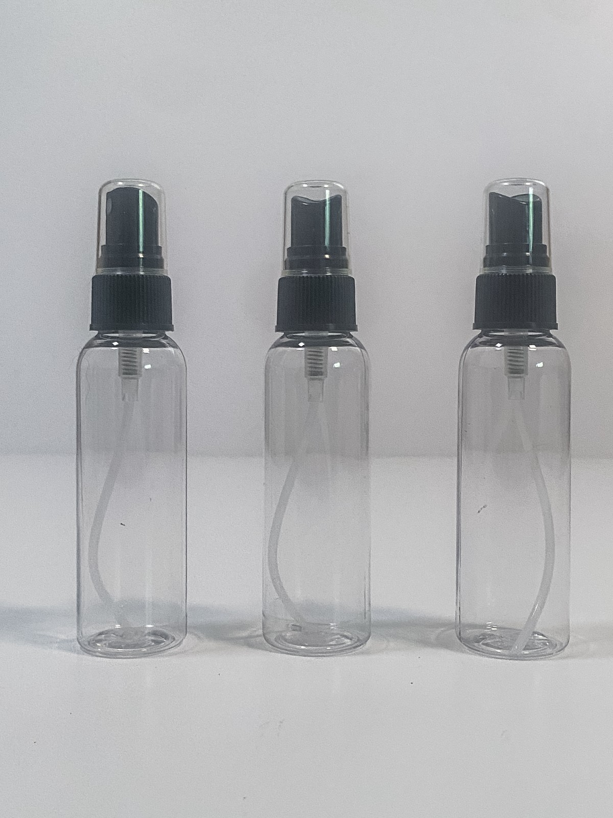 20 clear plastic spray bottles with black spray caps and tubes