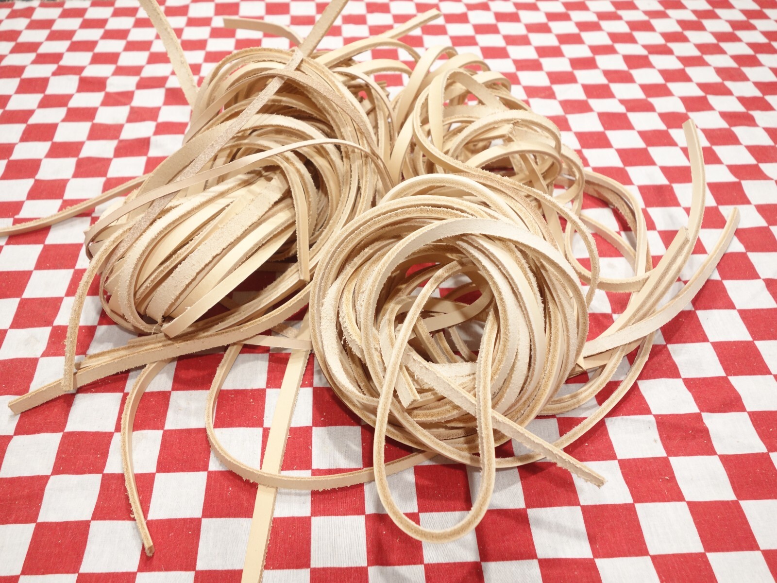 2 lbs. (32 ounces) bundle of assorted vegetable tanned cowhide leather strips