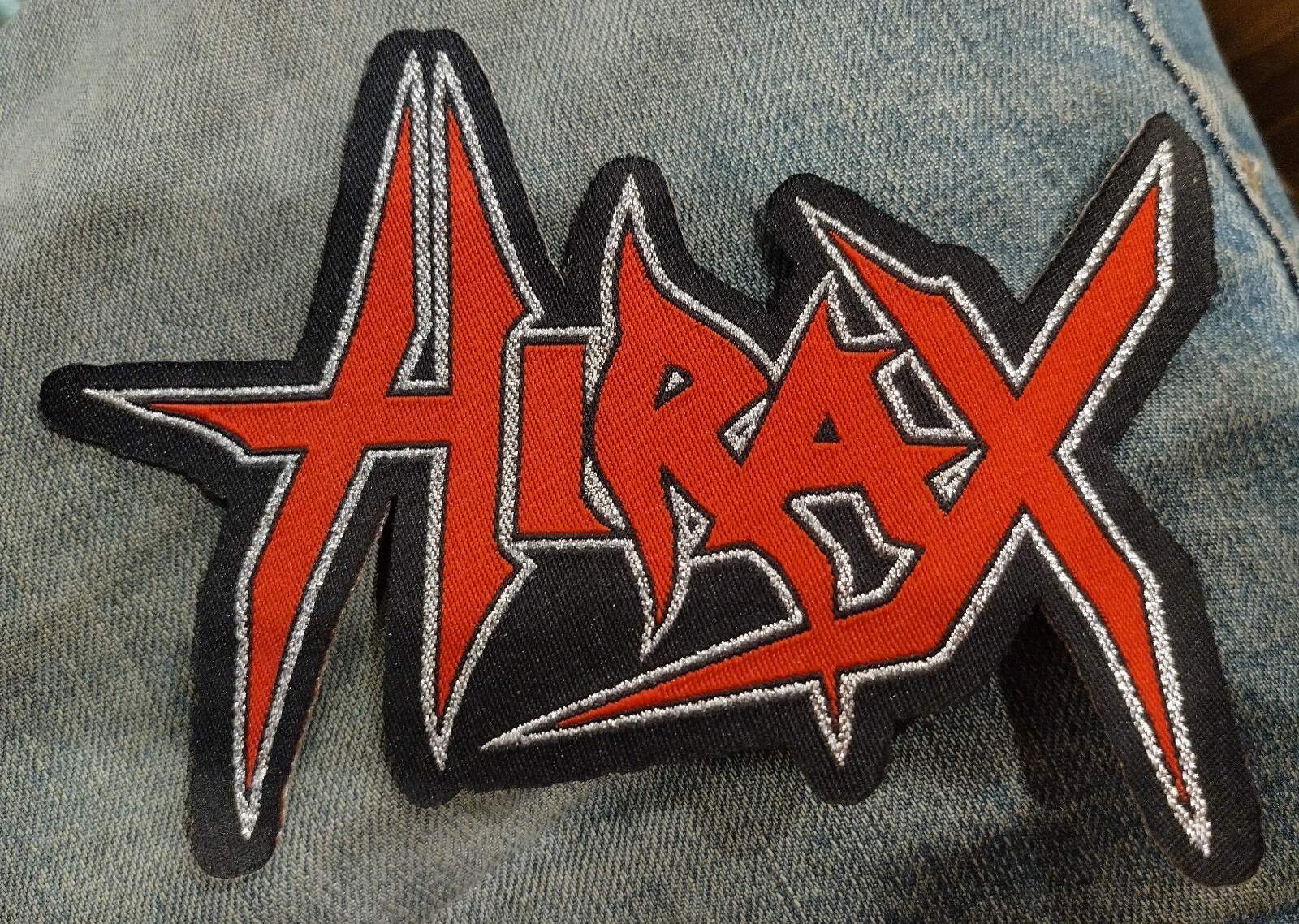 HIRAX Logo Laser Cut Shape Metallic Silver Threading In The Design 5 Inches Wide