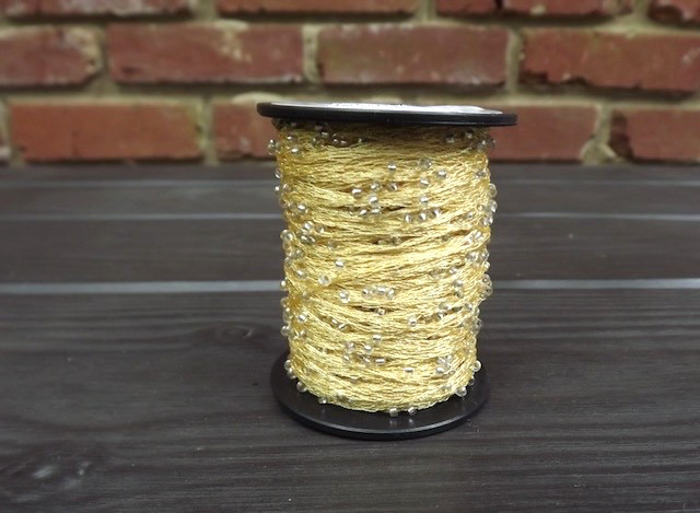 Lucci Yarn Style #125 beads, poly chain with glass beads, 110 yards/50 gr. spool