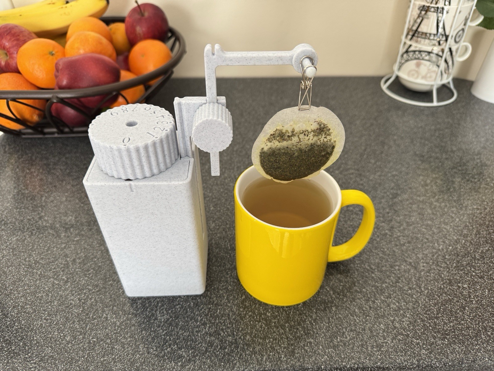Tea timer with tea bag lifter. Patent pending, made in USA.