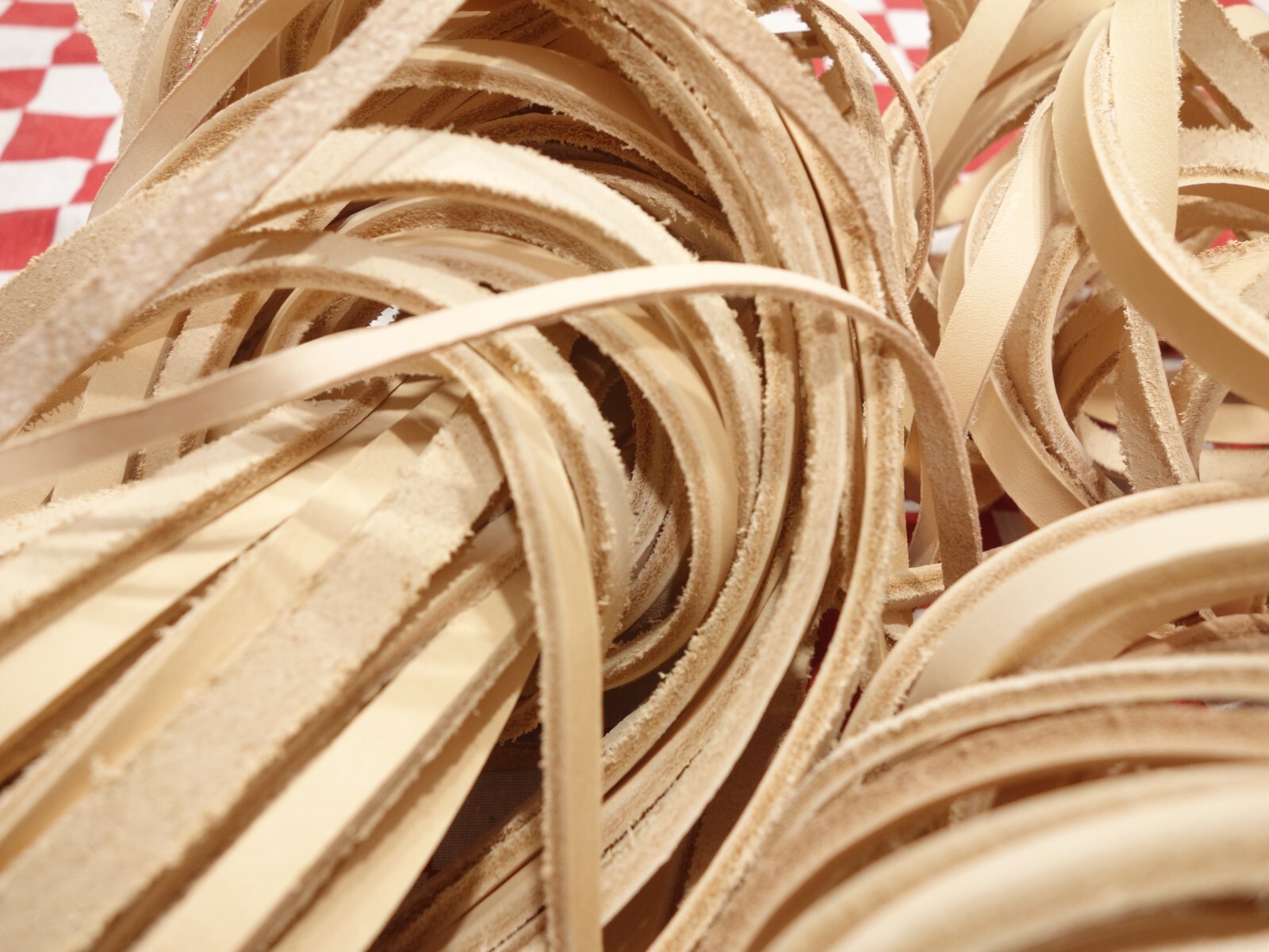 2 lbs. (32 ounces) bundle of assorted vegetable tanned cowhide leather strips