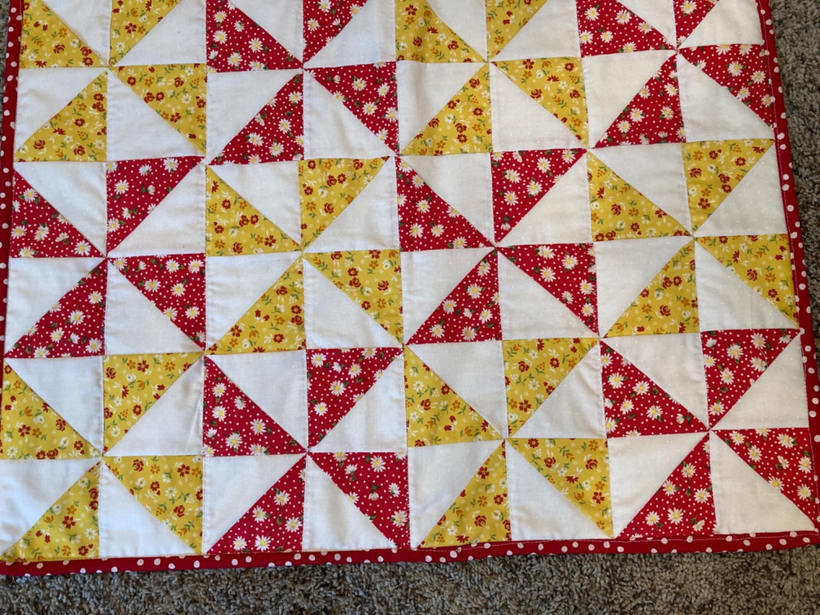 Handmade table topper – red and yellow pinwheels – 18” x 24”